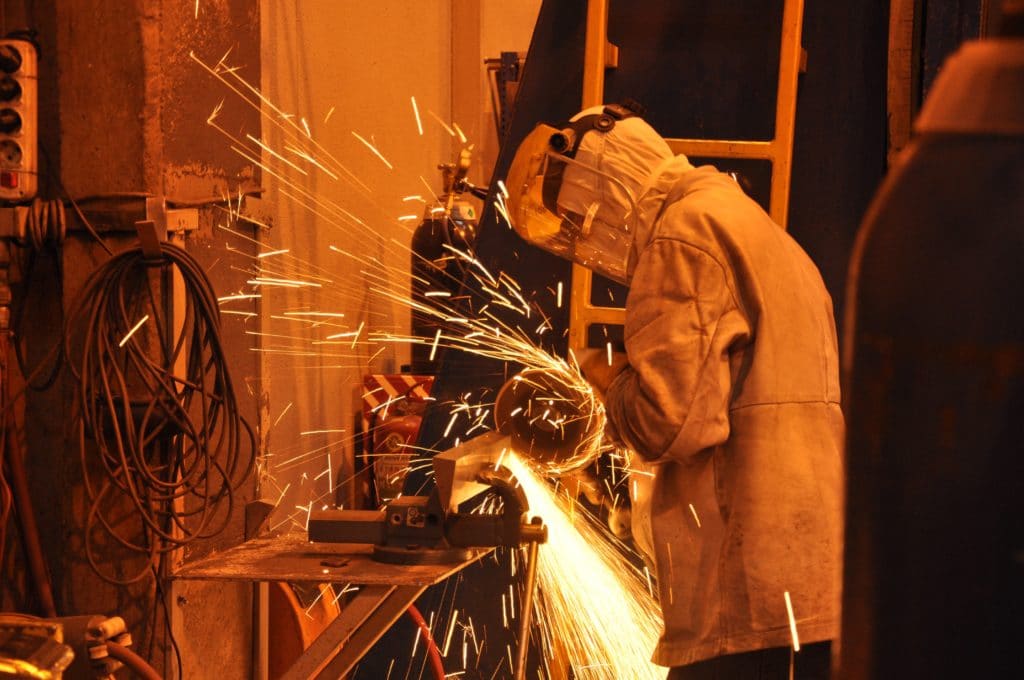 man welding showing an example of why Hot Work Permits are important
