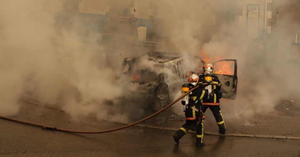Firemen putting out an Electric vehicle fire, incidents of which have increased over the last 5 years